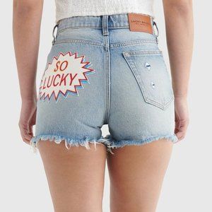 Lucky Brand High Rise Cut Off Jean Short "SO LUCKY" Comic graphic patch detail